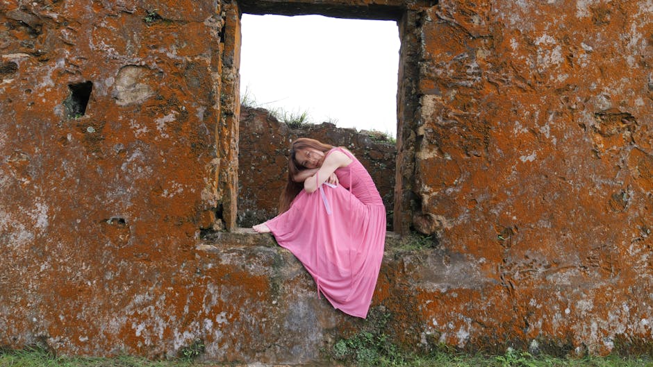 Senior woman reflecting in a serene stone setting